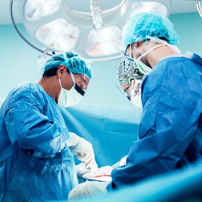 Team of Surgeons Operating.