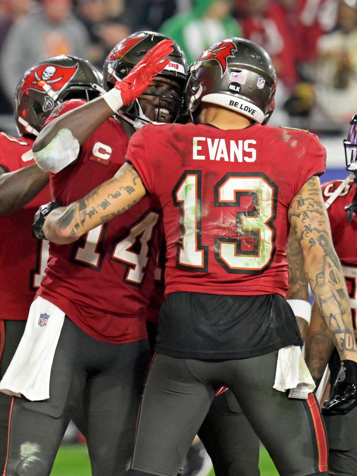 Tampa Bay Buccaneers wide receiver Mike Evans (13) congratulates Chris Godwin (14) after his touchdown catch against the Philadelphia Eagles during the second half of a wild card playoff game at Ra...