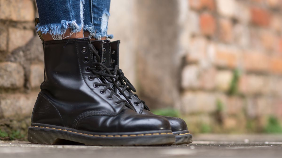 Rome, Italy - January 22, 2021: Classic black leather Dr. Martens AirWair boots. Dr Martens is an English footwear, accessories and clothing brand