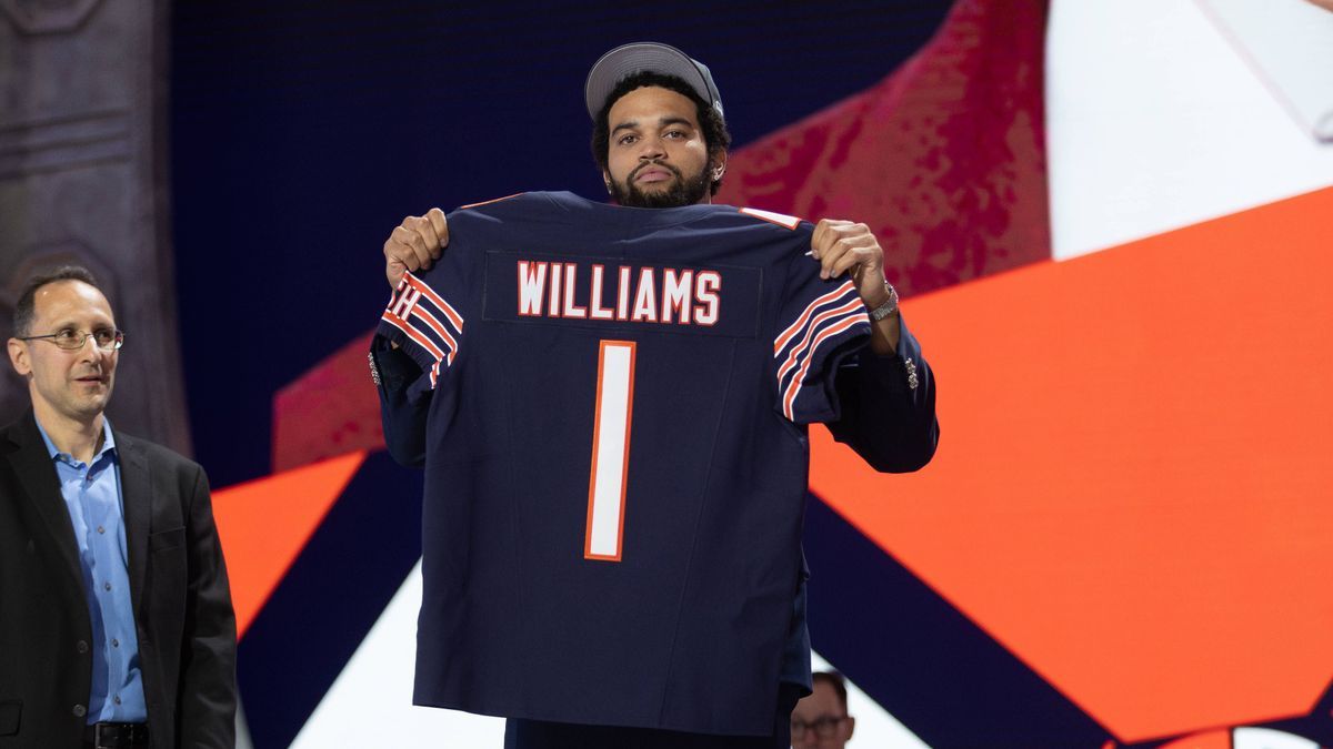 DETROIT, MI - APRIL 25: USC Quarterback Caleb Williams poses with his jersey after being taken first overall by the Chicago Bears during day 1 of the NFL, American Football Herren, USA Draft on Apr...