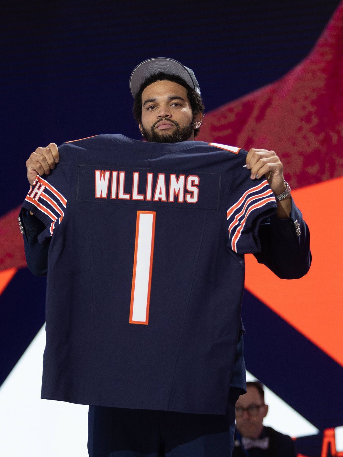 DETROIT, MI - APRIL 25: USC Quarterback Caleb Williams poses with his jersey after being taken first overall by the Chicago Bears during day 1 of the NFL, American Football Herren, USA Draft on Apr...