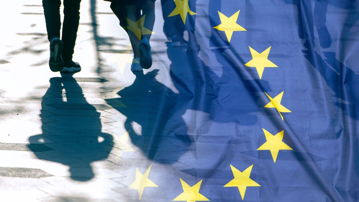 EU or European Union Flag and shadows of people, concept political picture	