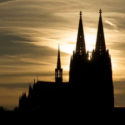 Famous World heritage Cologne Cathedral at sunset. Cathedral Church of Saint Peter, Cologne Cathedral (Kölner Dom) is a Roman Catholic cathedral in Cologne, Germany