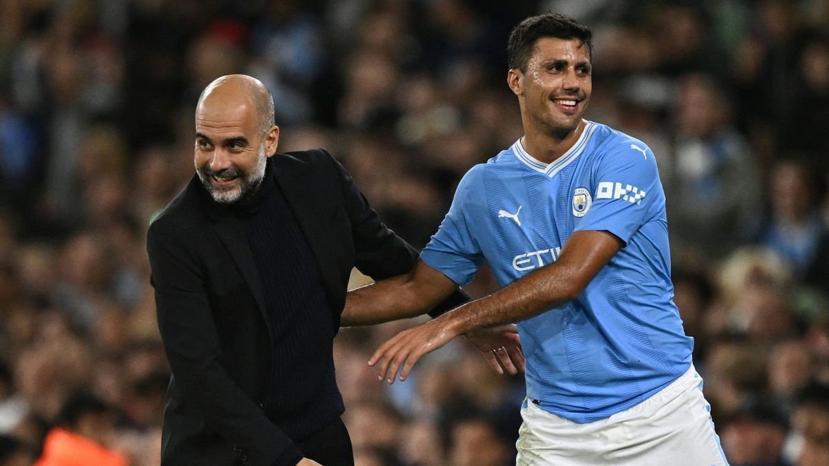 Seite an Seite: Pep Guardiola (l.) und Rodri