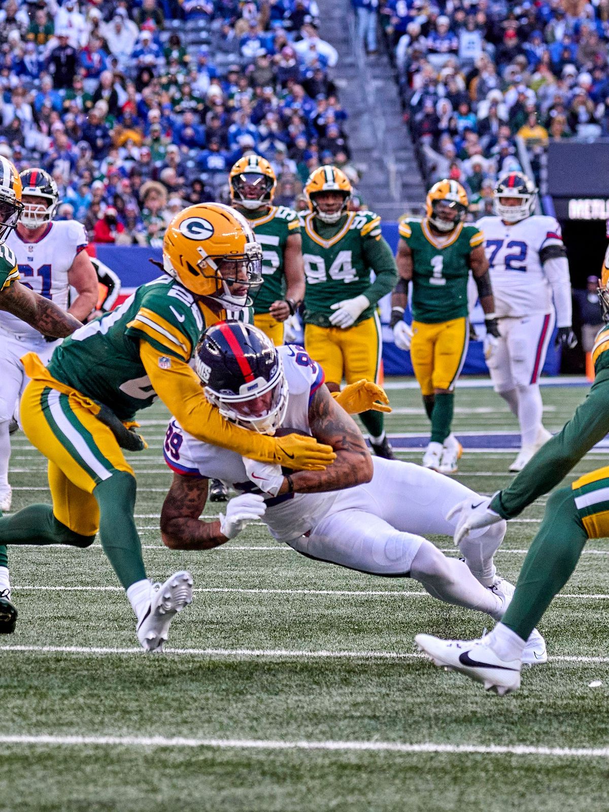 New York Giants wide receiver Lil Jordan Humphrey (89) is tackled by Green Bay Packers safety Xavier McKinney (29) after a catch and run during a NFL, American Football Herren, USA game at MetLife ...