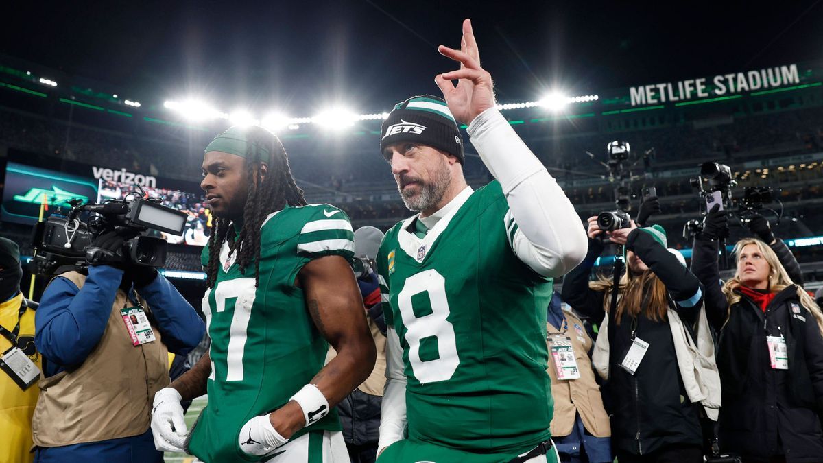 New York Jets quarterback Aaron Rodgers walks off of the field after the game against the Miami Dolphins where he threw his 500th touchdown pass in his 20-year career in the final week of the NFL, ...