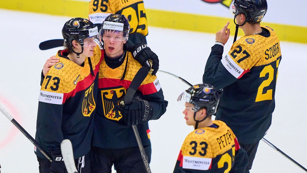 Lukas Reichel Nr.73 of Germany Jonas Mueller, Müller Nr. 41 of Germany John-Jason (JJ) Peterka Nr.33 of Germany NHL, Eishockey Herren, USA Buffalo Sabres) celebrate after the match in the prelimina...