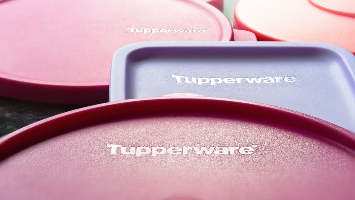 Tupperware lids. Close-up of Tupperware brand lids with logo. Textured image with shallow depth of field. Ukraine. Kyiv. 06.02.2023