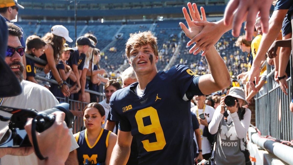 Syndication: Detroit Free Press Michigan quarterback J.J. McCarthy (9) high fives fans as he exits the field after the Michigan defeat Northern Illinois 63-10 at Michigan Stadium in Ann Arbor on Sa...