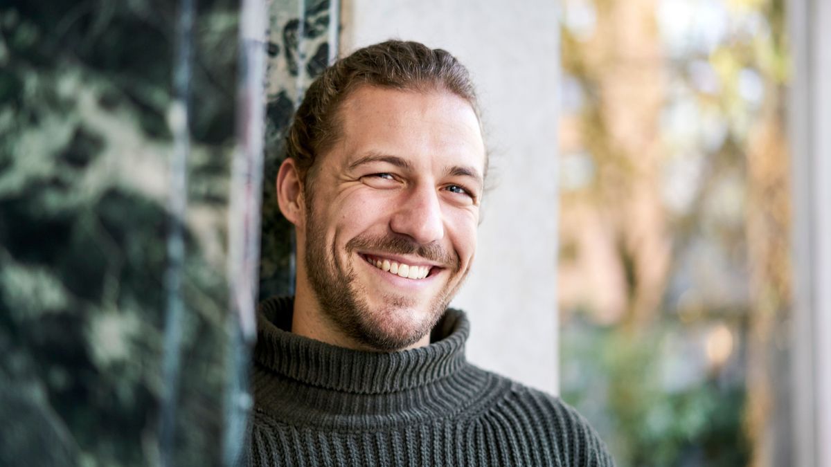 Portrait of bearded young man laughing