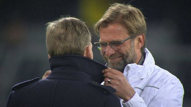 
                <strong>Klopp herzt Watzke</strong><br>
                ... Klopp richtet noch schnell Watzkes Mantelkragen, bevor er mit den "Reds" den Angriff in seiner alten Heimstätte startet.
              