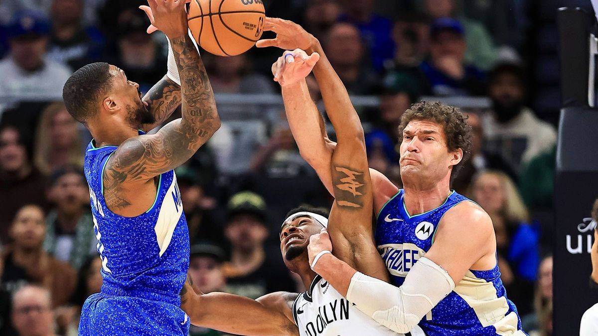 (240322) -- MILWAUKEE, March 22, 2024 -- Milwaukee Bucks guard Damian Lillard (L), Brooklyn Nets center Nic Claxton (C) and Milwaukee Bucks center Brook Lopez battle for a rebound during the NBA, B...