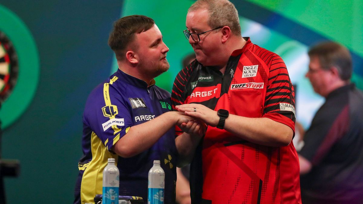 Paddy Power World Darts Championship Luke Littler celebrates and gestures with Stephen Bunting after winning the match during the Paddy Power World Darts Championship Semi-Final between Stephen Bun...