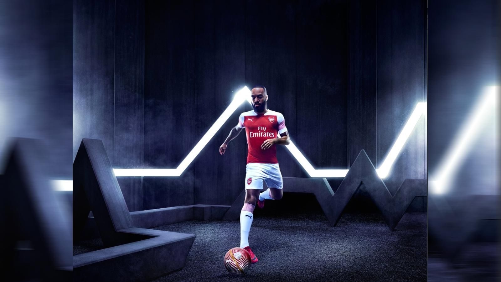 
                <strong>FC Arsenal </strong><br>
                Unter dem Hashtag #WeAreTheArsenal hat Arsenal London sein Heimtrikot für die Saison 2018/2019 vorgestellt. Wie es sich für die Gunners gehört, ist auch das neue Jersey im klassischen Chili-Pepper-Rot. Die weißen Ärmel sind jeweils mit einem roten Mikrostreifen versehen, um zusätzliche Akzente zu setzen. 
              