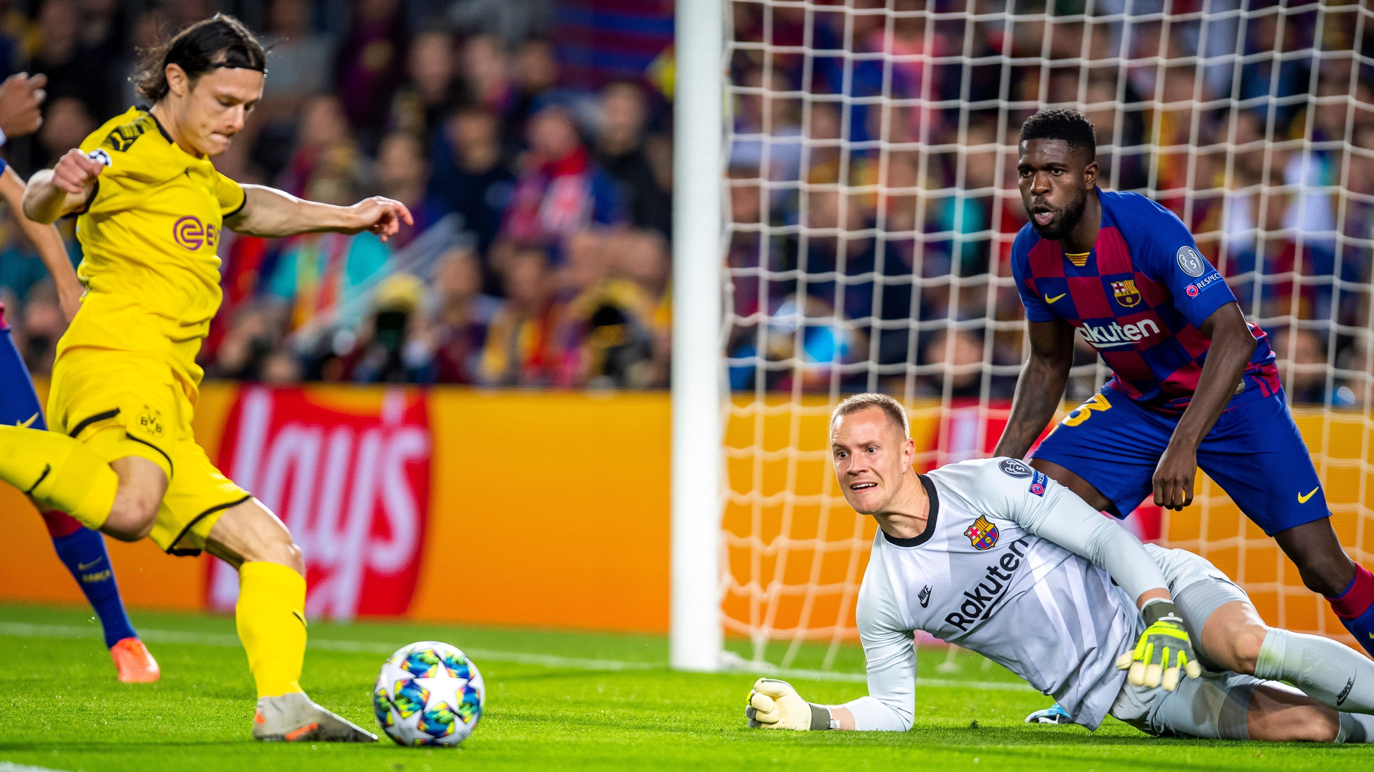 
                <strong>Marc-Andre ter Stegen (FC Barcelona)</strong><br>
                Bei der frühen BVB-Chance von Schulz benötigt der ehemalige Gladbacher die Hilfe von Umtiti. Danach lange Zeit kaum ernsthaft gefordert, ehe er gegen Brandt zur Stelle ist. Bei Sanchos Strich fliegt er vergeblich. Dafür lenkt er den zweiten scharfen Abschluss des Engländers überragend an die Latte. ran-Note: 2
              