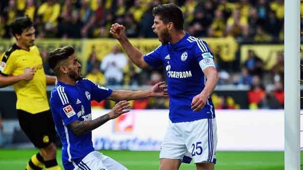 
                <strong>Klaas-Jan Huntelaar</strong><br>
                Klaas-Jan Huntelaar: Der Niederländer führte sich zunächst mit einer unschönen Szene ins Derby ein. Bei einem Luftduell schlug er Gegenspieler Gündogan den Ellenbogen ins Gesicht. Später griff er wieder auf seine gewohnten Stärken zurück und besorgte den Treffer zum zwischenzeitlichen 1:1-Ausgleich. Beim Treffer zum 2:3 bewies er zudem seine Kaltschnäuzigkeit und nutzte Sokratis' Patzer sofort aus. ran-Note: 2.
              