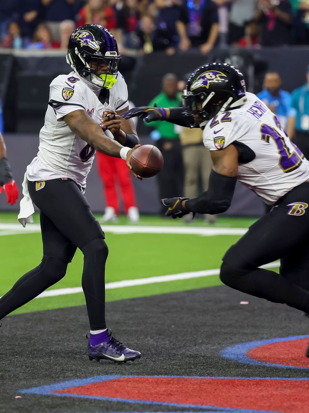 HOUSTON, TX - DECEMBER 25: Baltimore Ravens quarterback Lamar Jackson (8) hands the bal to Baltimore Ravens running back Derrick Henry (22) in the second quarter during the NFL, American Football H...