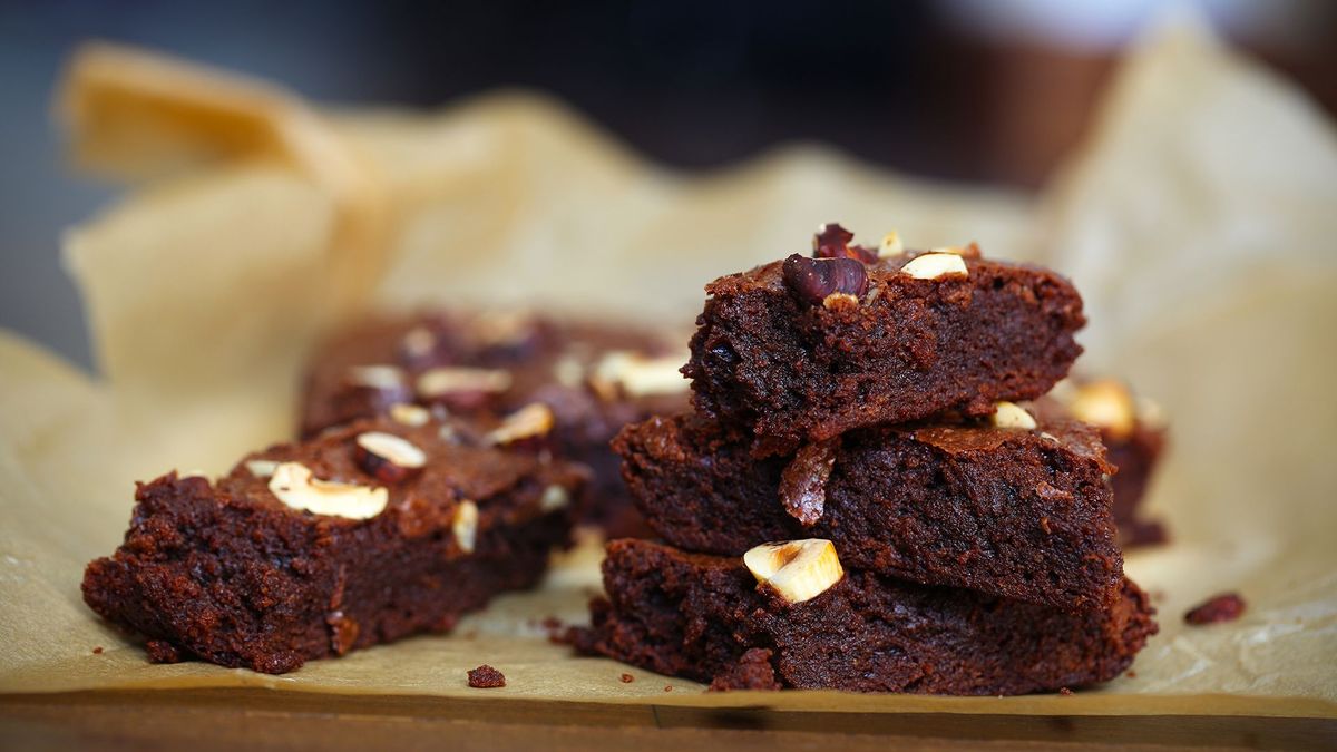 Chocolate fudge cake or brownie with hazelnuts, sliced portions