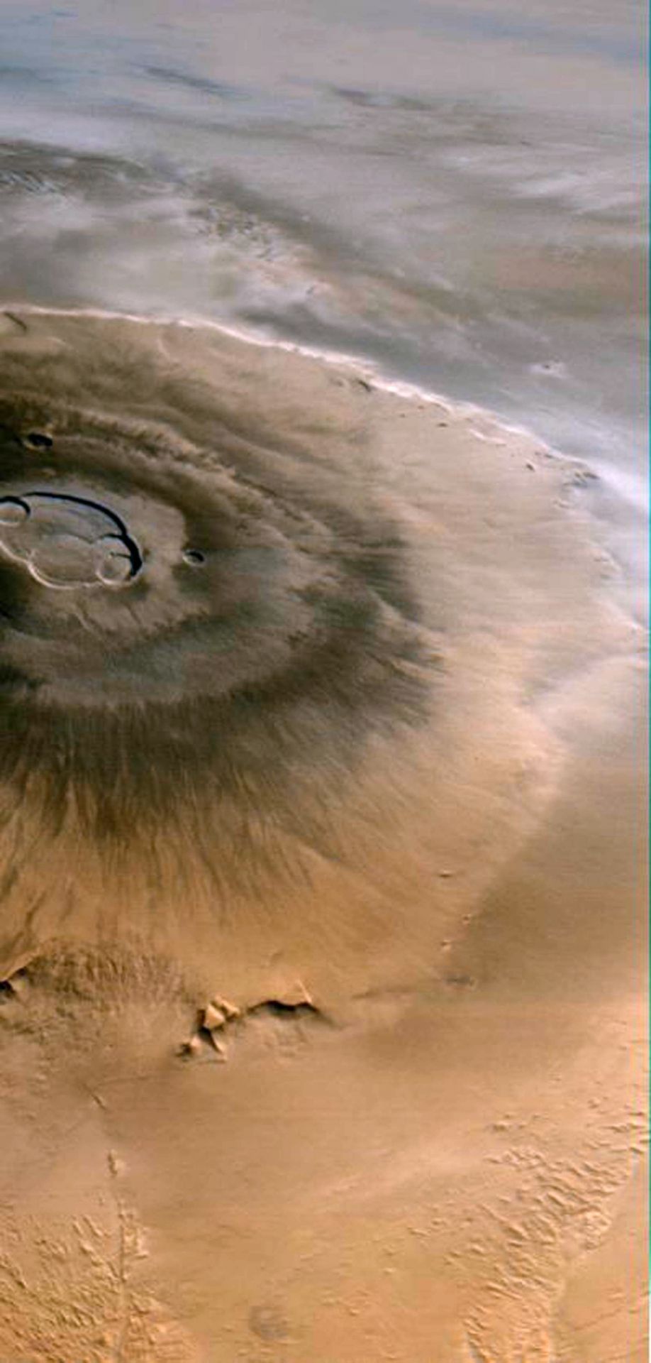Der Mars ist heute weitgehend erstarrt. Das war nicht immer so. Der marsianische "Olympus Mons" ist der höchste Berg in unserem Sonnensystem. Mit 26 Kilometer Höhe ist er rund 3-mal so hoch wie der Mount Everest (8.849 m).