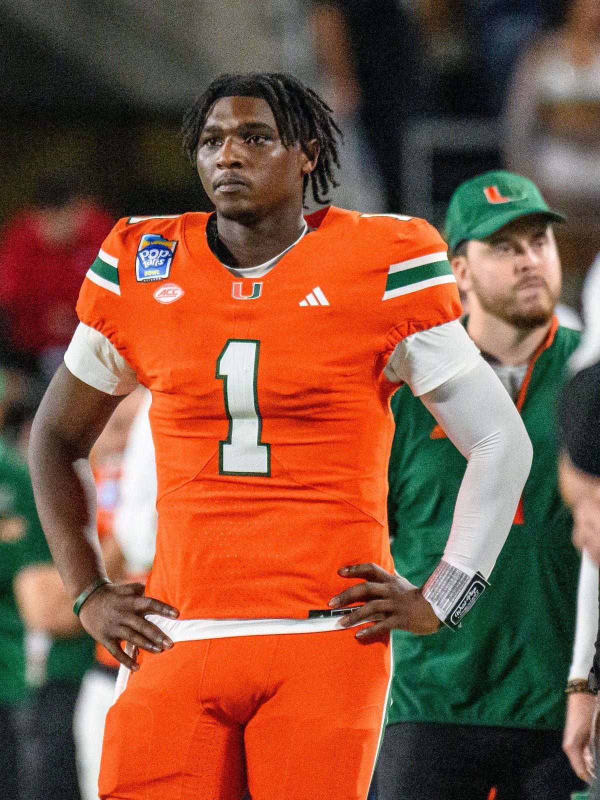 December 28, 2024: Miami Hurricanes quarterback Cam Ward (1) watches from the sideline in the 4th quarter during the Pop Tarts Bowl. Iowa State defeated Miami 42-41 in Orlando, FL. Romeo T Guzman C...