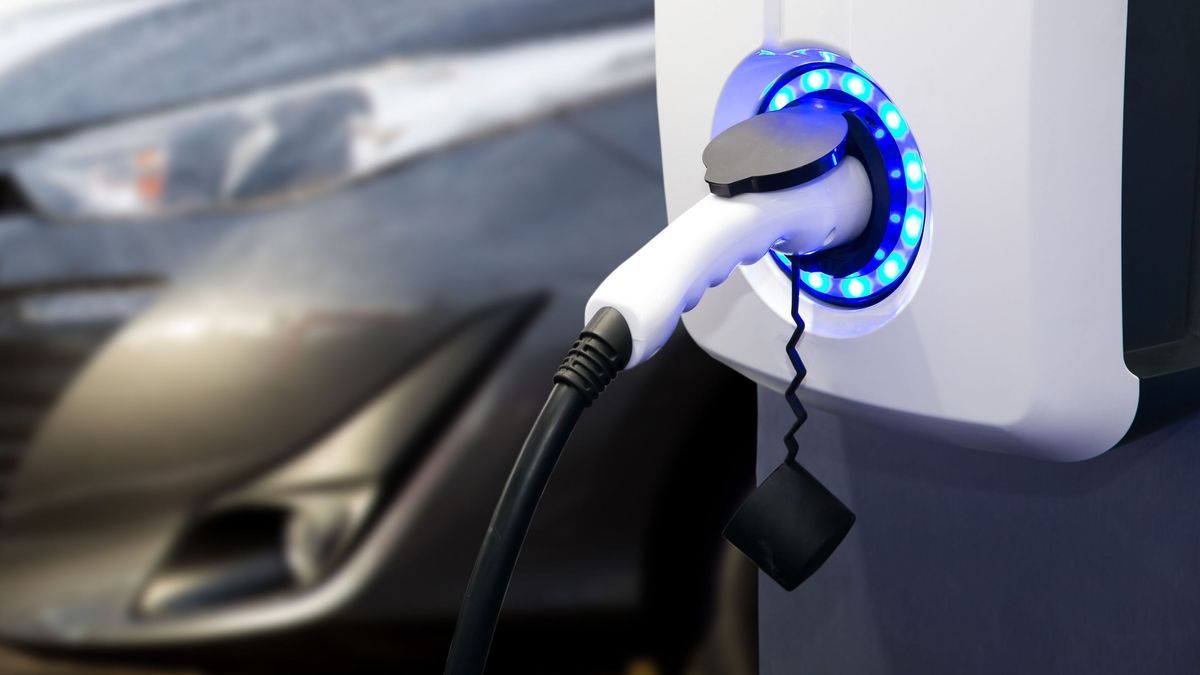 Power supply for electric car charging. Electric car charging station. EV Car battery charger at charge station electro mobilit. Environment friendly Car. Panoramic banner