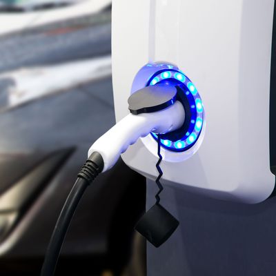 Power supply for electric car charging. Electric car charging station. EV Car battery charger at charge station electro mobilit. Environment friendly Car. Panoramic banner