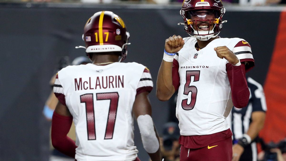 Washington Commanders quarterback Jayden Daniels (5) celebrates his touchdown with Terry McLaurin (17) against the Cincinnati Bengals during the first half of play at Paycor Stadium on Monday, Sept...