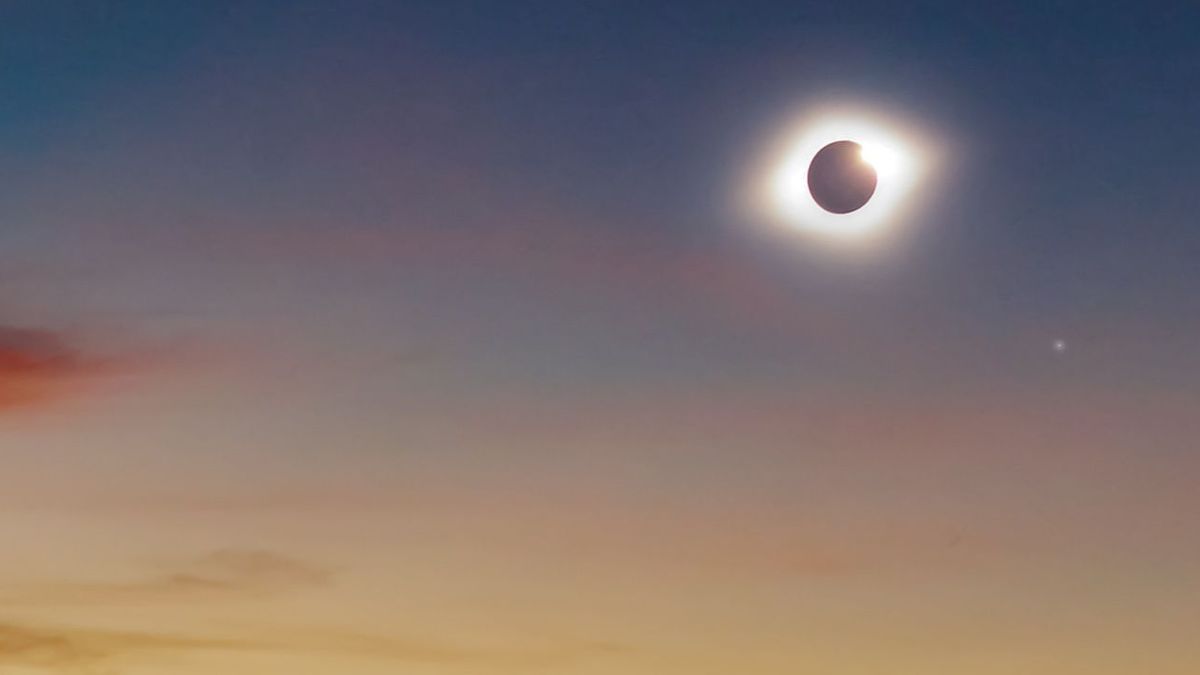 Solar eclipse on a colorful sky.