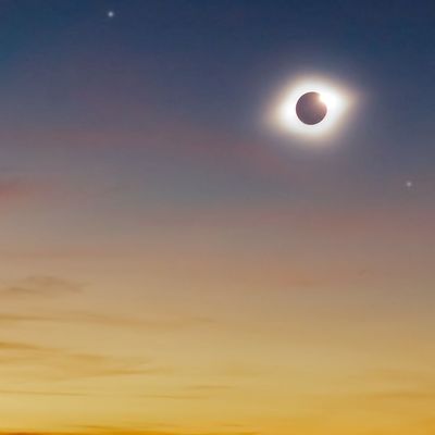 Solar eclipse on a colorful sky.