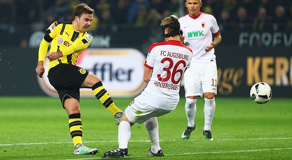 
                <strong>Mario Götze</strong><br>
                Mario Götze: In den ersten 25 Minuten mit einer richtig guten Partie. Begann auf der Doppelsechs, forderte im Spielaufbau einen Ball nach dem anderen. Traf in der 9. Minute dann auch noch den Pfosten. Den Rest der ersten Halbzeit nahm er sich dann etwas raus. Im zweiten Durchgang wieder aktiver, gab den Takt der Borussen vor. ran-Note: 2-.
              