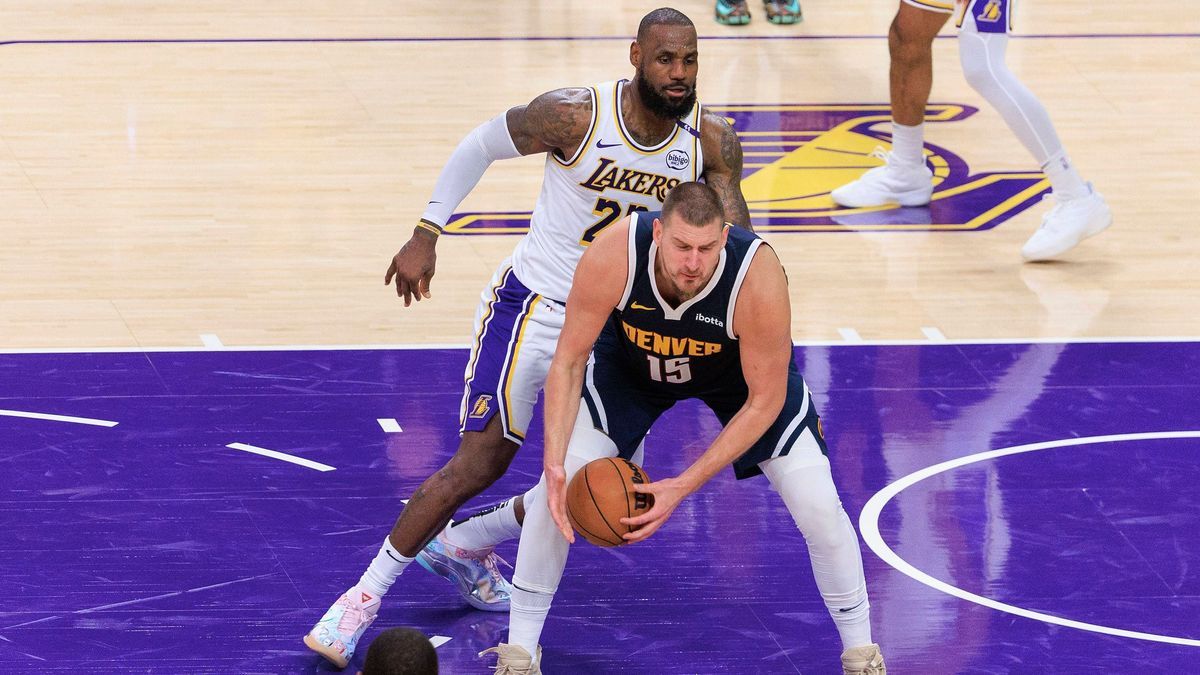 November 23, 2024, Los Angeles, California, USA: LeBron James 23 of the Los Angeles Lakers defends against Nikola Jokic 15 of the Denver Nuggets during their regular season NBA, Basketball Herren, ...