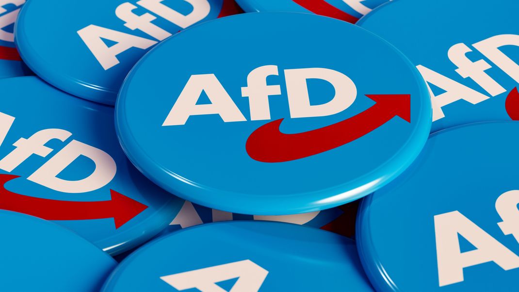 AFD - Altenative für Deutschalnd (Alternative for Germany) . Some political badges, campaign button on the table. German party, opposition, government. 3D illustration