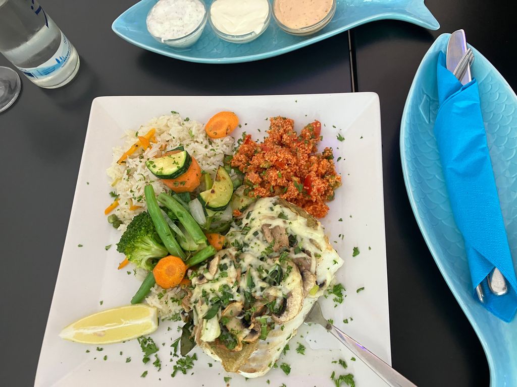 Kabeljaufilet mit Champignons und Käse überbacken