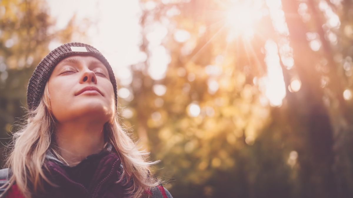 Young woman hiking and going camping in nature