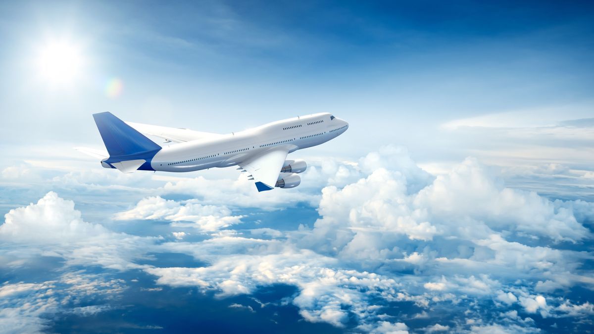 Airplane flying above clouds