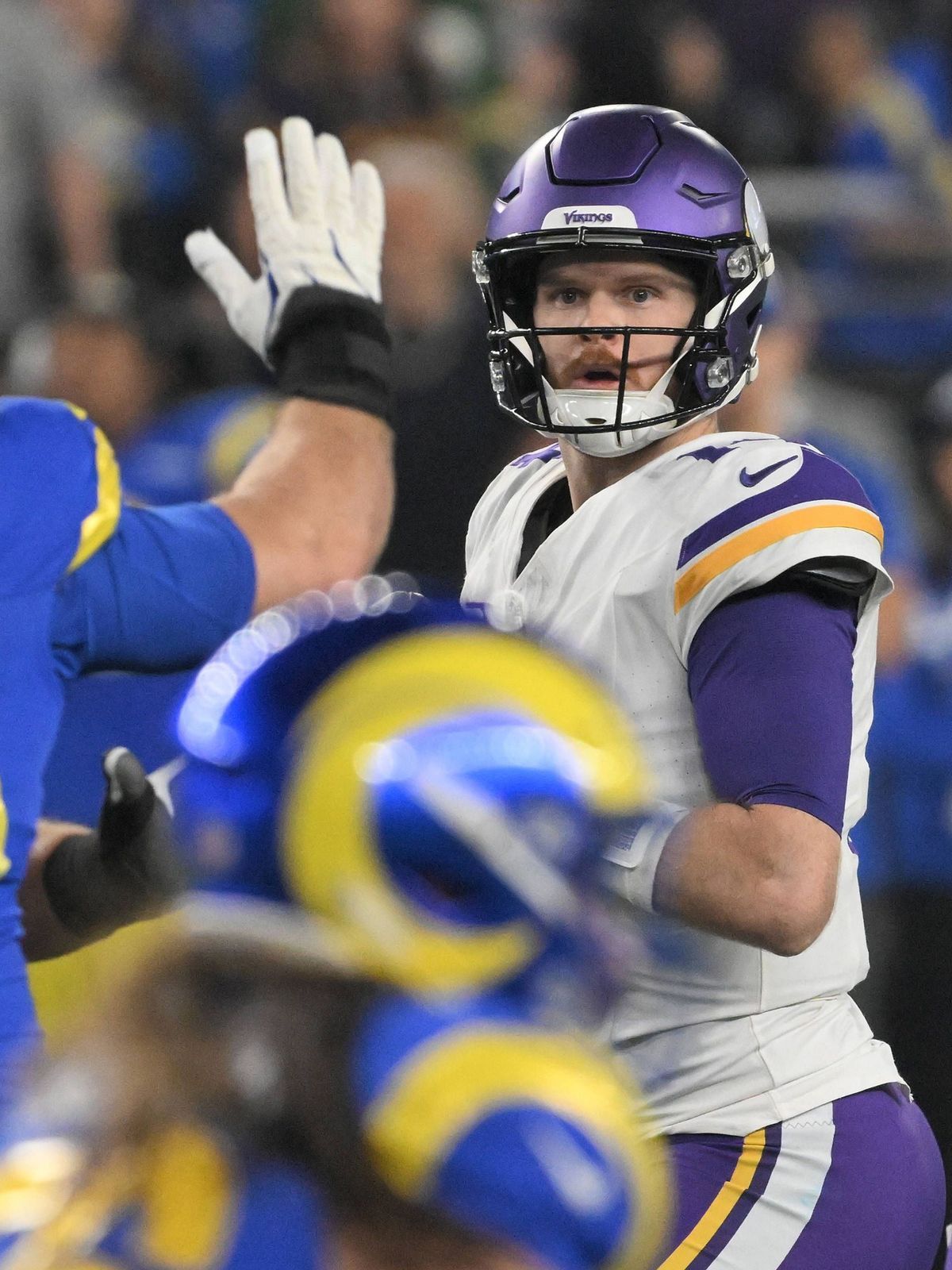 Minnesota Vikings quarterback Sam Darnold (14) looks downfield to pass in the first quarter against the Los Angeles Rams in the NFL, American Football Herren, USA Wild Card game at State Farm Stadi...