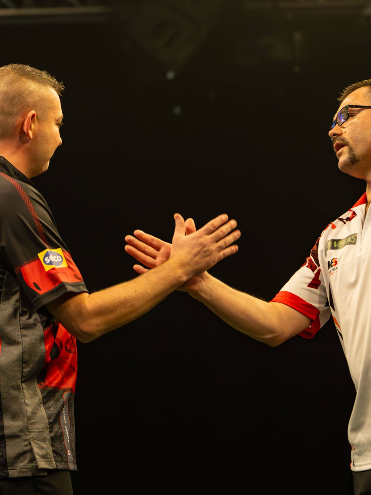 12th November 2023, WV Active, Aldersley, Wolverhampton, England; 2023 PDC Grand Slam of Darts, Day 2 Afternoon Session; Damon Heta congratulates Nathan Aspinall on his victory PUBLICATIONxNOTxINxU...