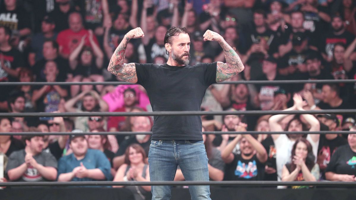 August 10, 2022, Minneapolis, Minnesota, USA: August 10,2022 - Minneapolis, Minnesota.USA.Target. AEW wrestling superstar CM Punk enters the ring to battle Chris Jericho (not shown) but also confro...