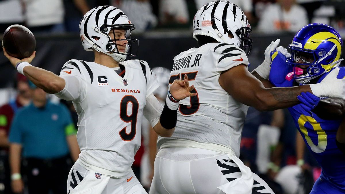 Cincinnati Bengals quarterback Joe Burrow (9) throws the football under pressure from Los Angeles Rams defense during the first half of play at Paycor Stadium on Monday, September 25, 2023 in Cinci...