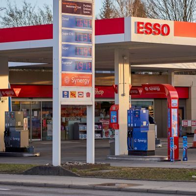 Price display in front of a Esso gas station (tankstelle) at dawn. High and expensive fuel prices in europe.