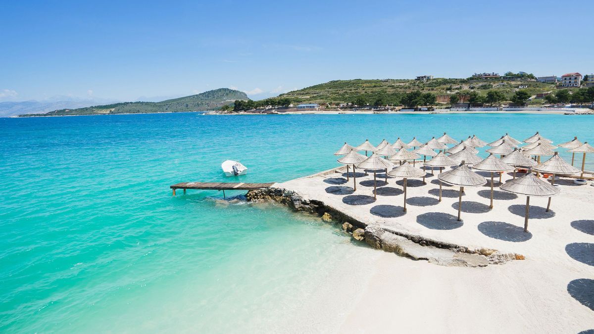 Sunshade umbrellas on the small beautiful Ksamil beach, Albania.