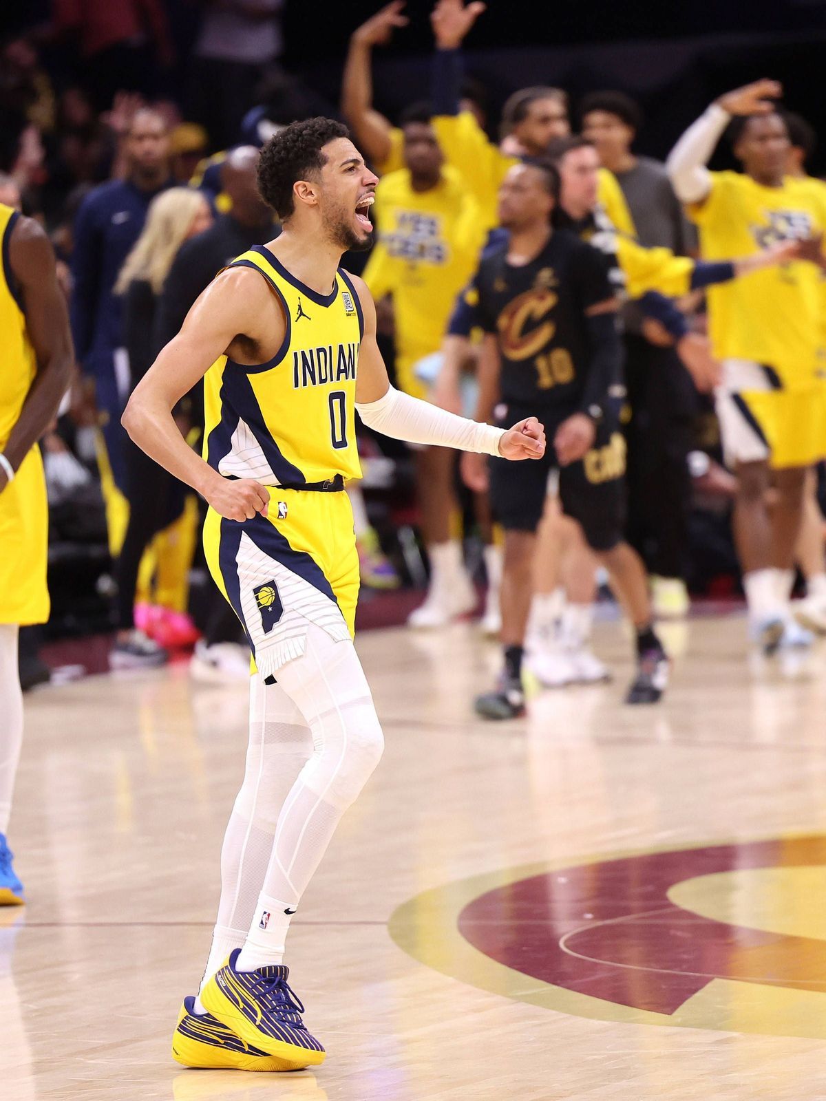 Indiana Pacers point guard Tyrese Haliburton (0) reacts after a Pacers three point shot against the Cleveland Cavaliers during the third quarter of game 5 of the Eastern Conference semifinals in Cl...