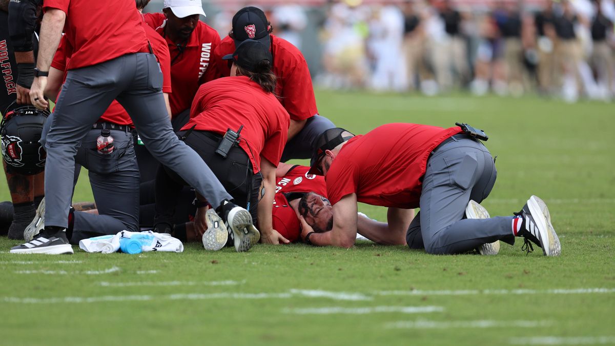 October 5, 2024, Raleigh, North Carolina, USA: NC State trainers delivering care to QB Grayson McCall after hard hit during the ACC Football match between Wake Forest University and NC State at Car...