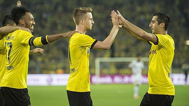 
                <strong>Reus Aubameyang Mkhitaryan (Borussia Dortmund)</strong><br>
                Platz 3 - Borussia Dortmund: Pierre-Emerick Aubameyang, Marco Reus, Henrich Mchitarjan. Ebenfalls 35 Tore hat das erfolgreiche BVB-Trio, bestehend aus Aubameyang, Reus und Mkhitaryan auf dem Konto. Besonders für Aubameyang läuft es mit 21 Toren wie am Schnürchen.
              