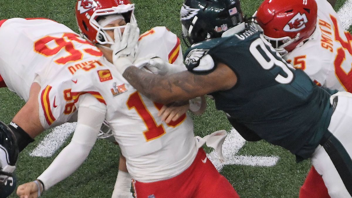 Philadelphia Eagles defensive tackle Jalen Carter (98) grabs Kansas City Chiefs quarterback Patrick Mahomes (15) in the face mask in the fourth quarter in Super Bowl LIX at Caesars Superdome in New...