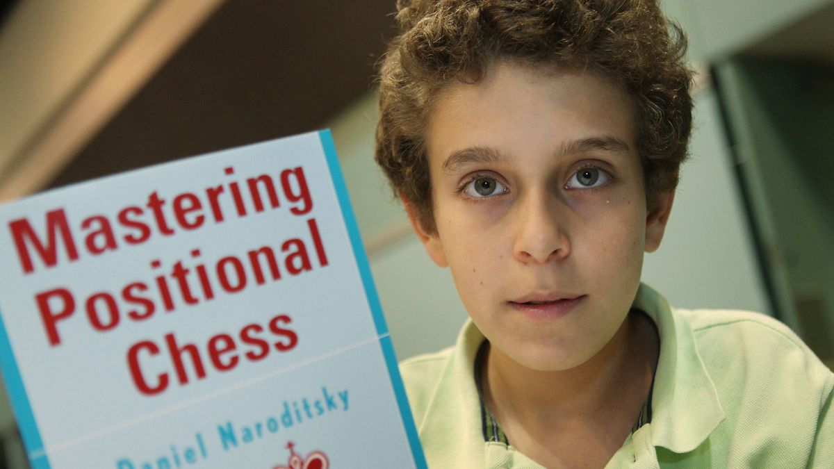 HBY-CMP-CHESSMASTER Daniel Naroditsky, 14, of Foster City, California, holds up his chess book, on April 17, 2010. Naroditsky is the top-ranked American chess player in his age group. (Jim Gensheim...
