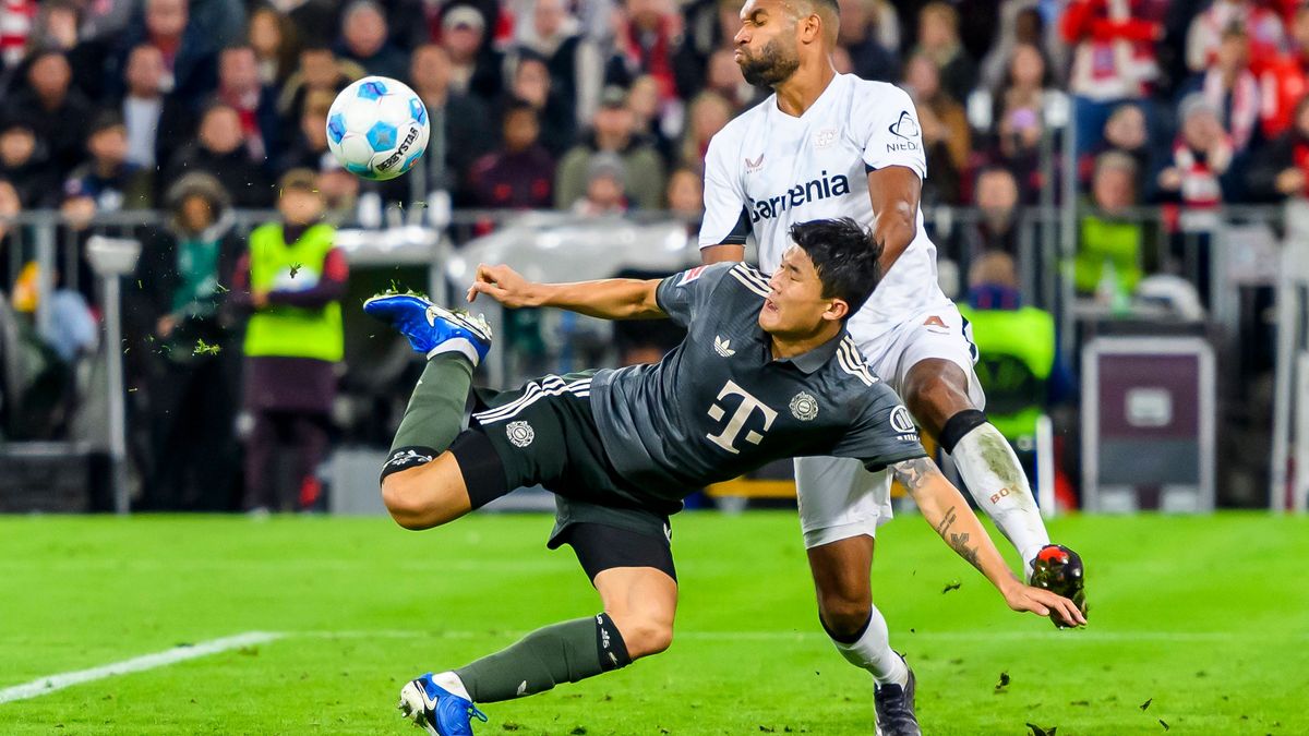 GER, DFB, FC Bayern Muenchen vs. Bayer 04 Leverkusen 28.09.2024, Allianz Arena, Muenchen, GER, DFB, FC Bayern Muenchen vs. Bayer 04 Leverkusen , im Bild Min-jae Kim (FCB 3) im Zweikampf gegen Jonat...