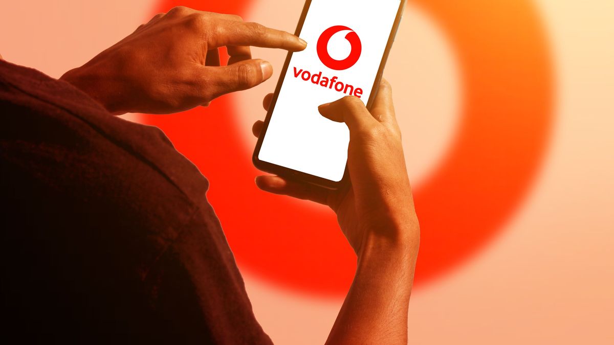 pringsewu, Lampung; November 26, 2023; A man's hand holds an Android cellphone with the logo of the British multinational telecommunications company "Vodafone" on the cellphone screen. optical flare