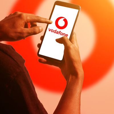 pringsewu, Lampung; November 26, 2023; A man's hand holds an Android cellphone with the logo of the British multinational telecommunications company "Vodafone" on the cellphone screen. optical flare