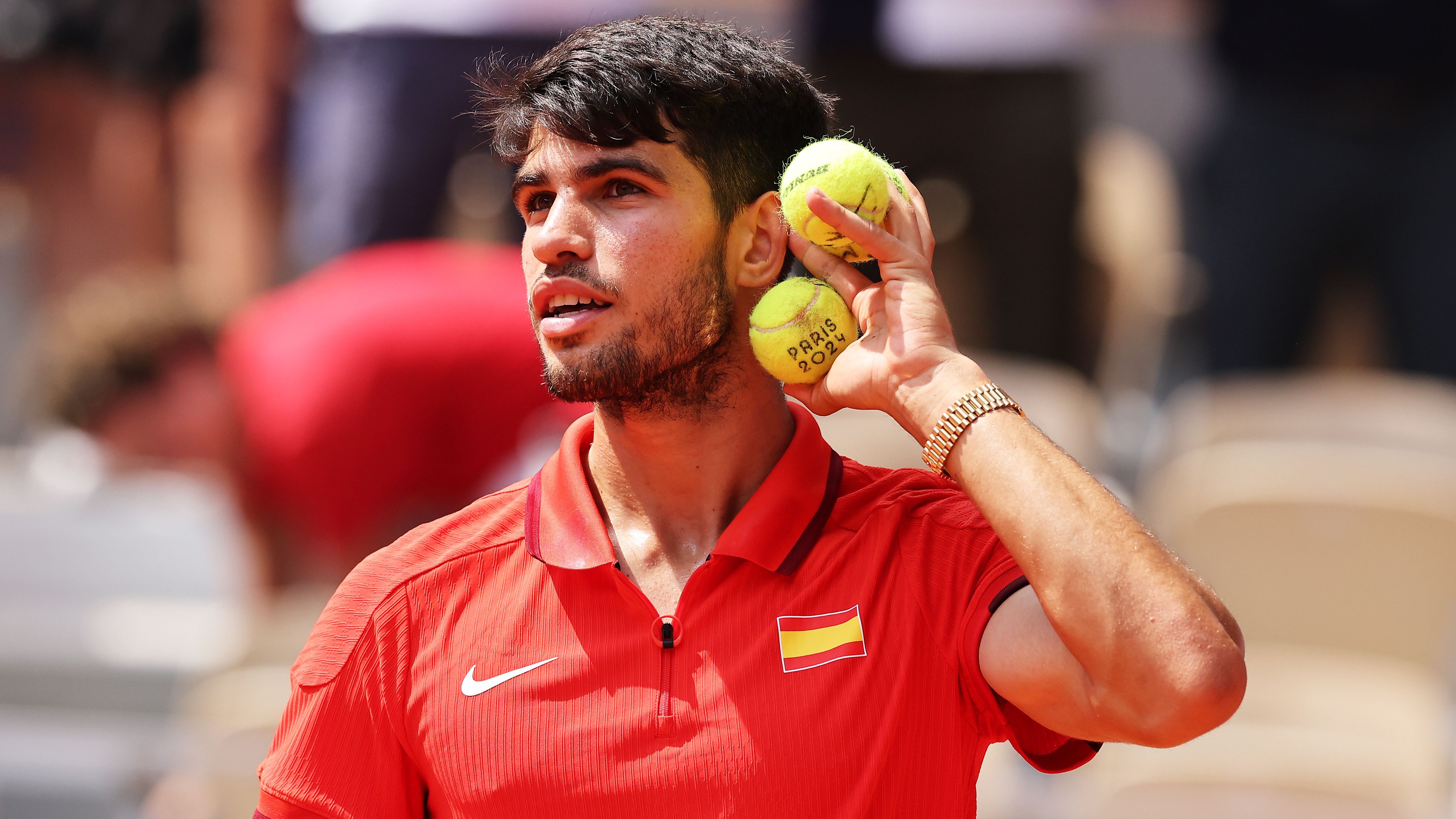 <strong>Olympia: Die besten Bilder des siebten Tages</strong><br>Carlos Alcaraz steht im Olympia-Finale, kann wegen der Tennisbälle am Ohr aber wohl nicht so richtig hören.